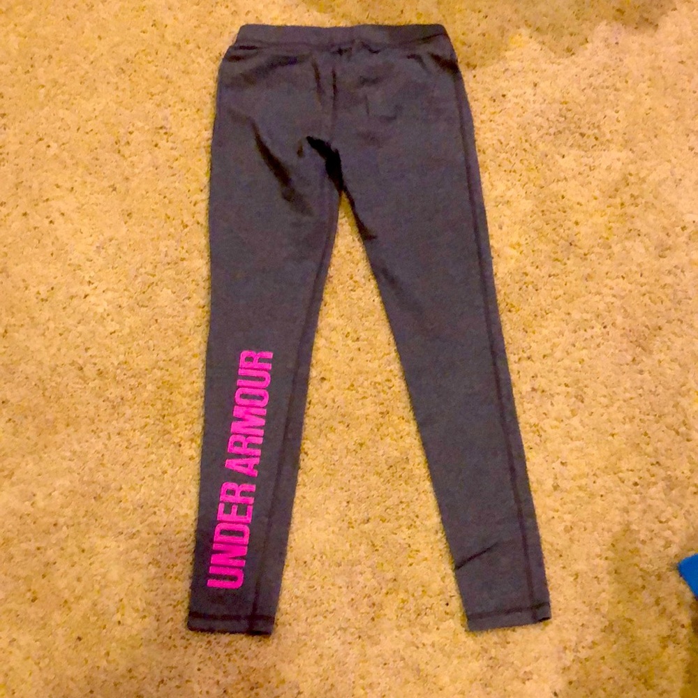 Womens Under Armour Leggings Size M with Pink Under Armour on back Left Leg